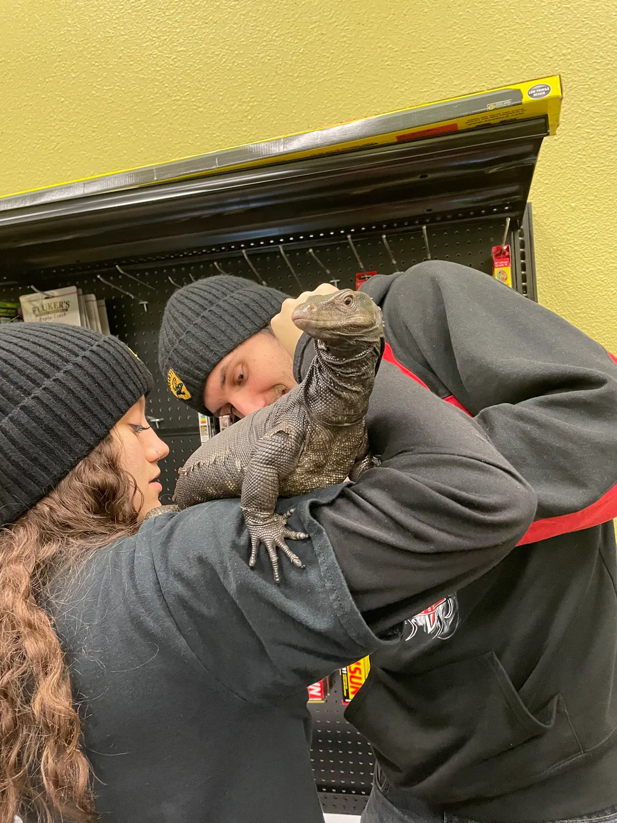 Tyler and Jasmyn with an iguana