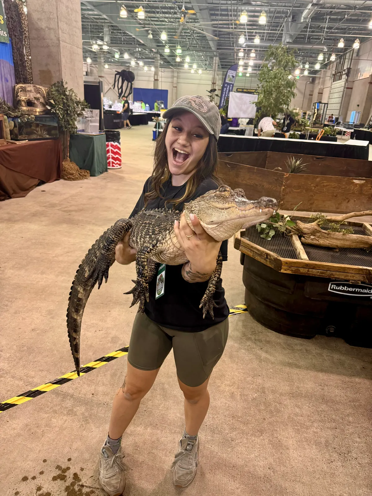 Jasmyn holding an alligator at a reptile expo