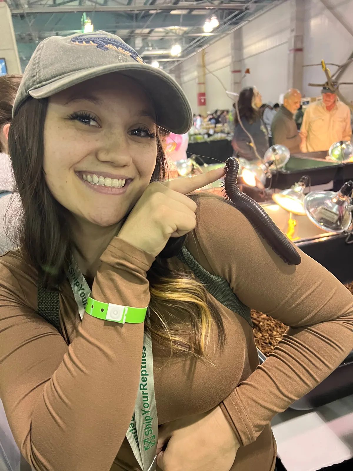 Jasmyn with a snake at a reptile expo